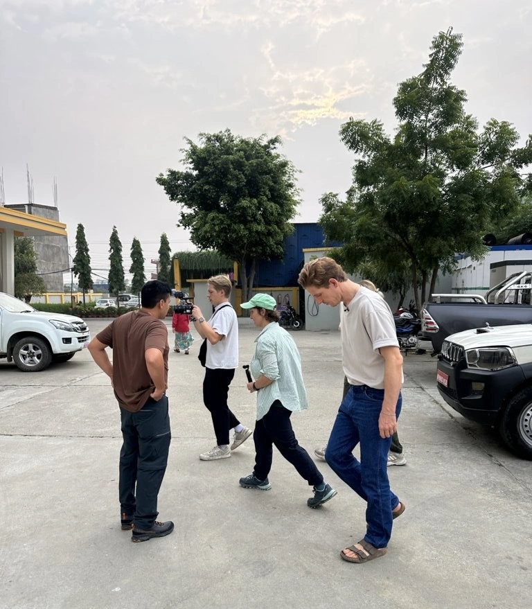 CEO of Wilderness Film Productions escorting clients to an event