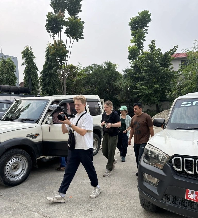 Bhuwan Bharati Sir escorting clients to an event